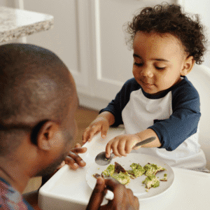 Toddler eating his lunch