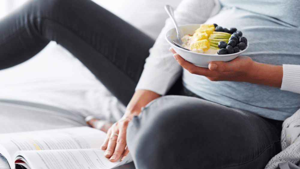 Pregnant woman eating a nutritious breakfast