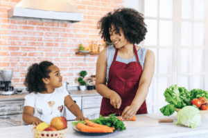 Mother and daughter cooking together