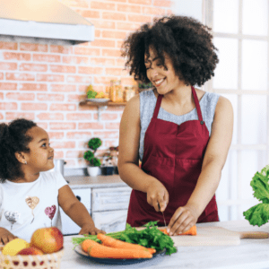 Mother and daughter cooking together