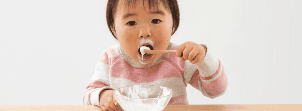 Girl eating yoghurt
