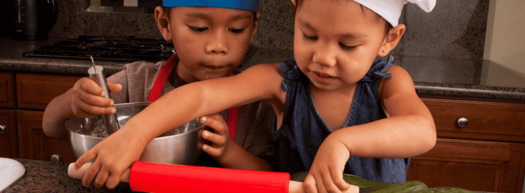 Brother and sister cooking in the kitchen
