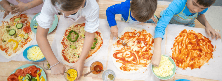 Children making pizzas at nursery